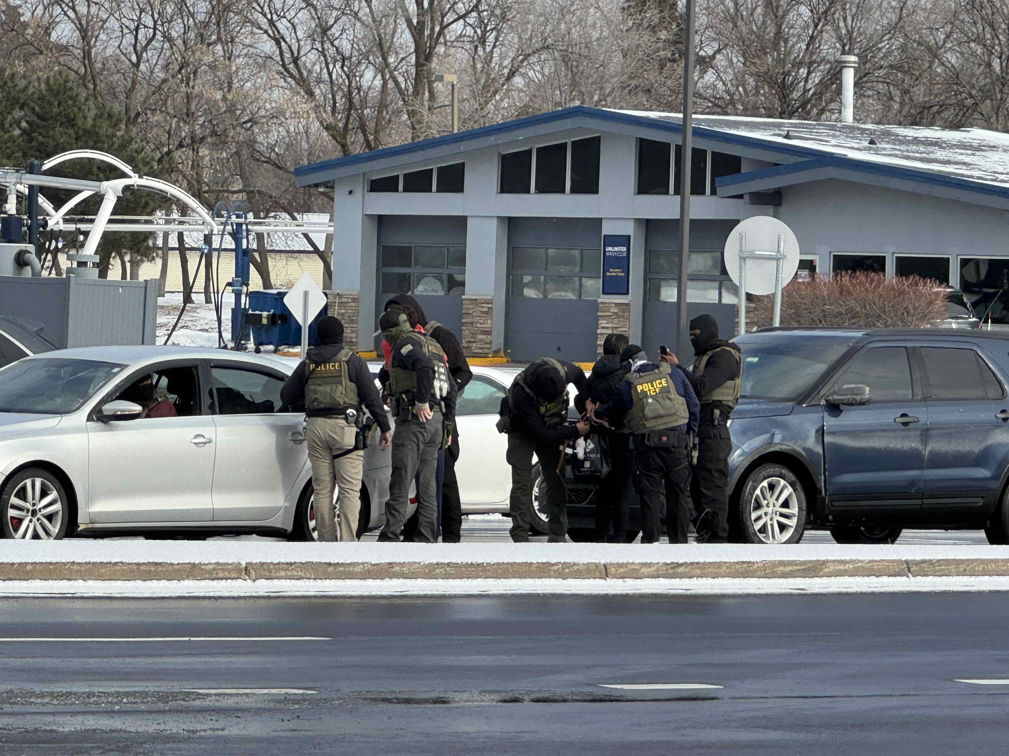 A photograph of an ICE arrest on January 10th, 2026 in Brooklyn Park, MN